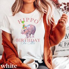 Celebrate birthdays in style with this Viral Baby Hippo Moo Deng Shirt. Adorned with a cute baby hippo wearing a party hat, it is perfect for hippo lovers and those who appreciate sarcastic animal memes. This shirt captures the fun and festive spirit, making it an ideal gift for hippo birthdays, hippo holidays, and Christmas. It's a delightful addition to any animal-themed apparel collection. ⭐️ SWEATSHIRTS: These UNISEX cozy sweatshirts are soft and durable! The heavy blend crewneck sweatshirt is pure comfort, made from polyester and cotton, this combination helps designs come out looking fresh and beautiful. This classic fit, preshrunk, poly/cotton blend maintains its shape over time and has no itchy seams or tags.  PLEASE SEE SIZE CHARTS ⭐️ TEE SHIRTS: This classic Unisex jersey short s Hippo Birthday, Hippo Christmas, Hippopotamus, Party Hat, Cozy Sweatshirts, Animal Memes, Size Charts, Jersey Shorts, San Jose