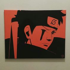 an orange and black painting of a man's face on a white wall with red background