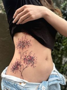 a woman's stomach with flowers on it