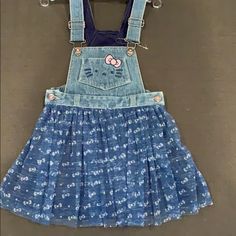 Never Worn Size 3t Denim Tutu Overall Dress Blue Denim Dress For Playtime In Spring, Playful Denim Dress For Playtime, Cute Denim Dress For Playtime, Cute Medium Wash Denim Dress, Playful Denim Dress For Spring, Cute Blue Cotton Denim Dress, Casual Hello Kitty Print Dress For Spring, Cute Fitted Denim Dresses, Hello Kitty Dress