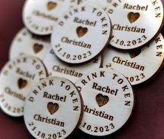 personalized wooden buttons with names and hearts for wedding favors or baby's first birthday gifts