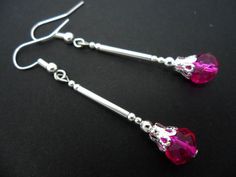 A pair of pretty long faceted pink bead   dangly earrings. Pink Faceted Earrings For Jewelry Making, Pink Faceted Drop Earrings, Pink Dangling Beads Long Drop Earrings, Pink Dangle Crystal Earrings With Faceted Beads, Pink Long Drop Earrings With Dangling Beads, Elegant Pink Beaded Earrings With Faceted Beads, Elegant Pink Crystal Earrings With Dangling Beads, Elegant Pink Earrings With Faceted Beads, Pink Dangle Earrings With Faceted Beads