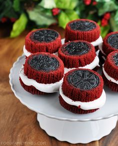 red velvet cupcakes with white frosting on a plate