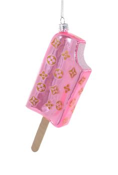 a pink popsicle ornament hanging from a string