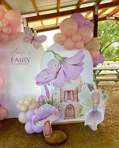 a fairy themed birthday party with balloons and decorations