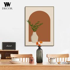 a vase with flowers in it sitting on a table next to a wall mounted speaker