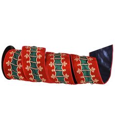 a roll of red and green ribbon with gold designs on the edges, set against a white background