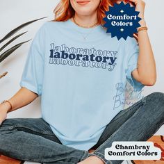 Laboratory Comfort Colors T Shirt, Long Sleeve Tee, or Sweatshirt.  Customize the text to Blood Bank, Lab Tech, Scientist, Stem Cell, Micro, Histology or whatever you like.  Perfect gift for Lab Week 2024! Get your coworker something they can wear year round!  📫 Super Fast Shipping! Most sizes and colors Ship Next Business Day! 👚T Shirt Version Here with pics https://blazingbotanicals.etsy.com/listing/1672220202 🧵 All Size Charts Here https://blazingbotanicals.etsy.com/listing/1684651987 ✨ SI Blue Relaxed Fit Tops With Lettering, Blue Graphic Tee With Lettering, Blue Short Sleeve T-shirt With Lettering, Blue Short Sleeve Tops With Lettering, Medical Lab Technician, Lab Week, Medical Lab, Lab Technician, Lab Tech