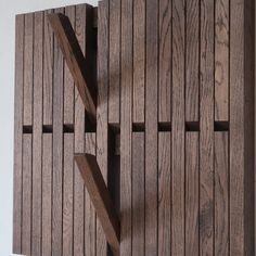 a wooden wall with multiple pieces of wood on it