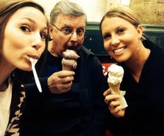 two women and an older man eating ice cream