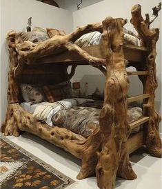 a bed made out of tree trunks in a room