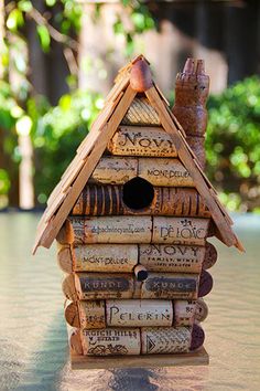 a bird house made out of wine corks