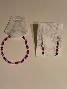 Custom made bicone bead earrings and  bracelets. Red, white and blue. Bracelets are tied off and non adjustable. $18 for each set multiple colors available. Standard shipping costs Patriotic Adjustable Dangle Jewelry, Patriotic Jewelry With Colorful Beads As Gift, Patriotic Colorful Beaded Jewelry Gift, Handmade Patriotic Bracelet Jewelry, Patriotic Handmade Bracelet Jewelry, Patriotic Adjustable Colorful Beads Jewelry, Adjustable Patriotic Jewelry With Colorful Beads, Blue Bracelets, Bracelets Red