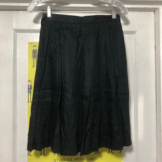 "Vintage Pleated High Waisted Black Tennis Skirt  Tag says size 4.  Made in Taiwan ROC. 100% rayon.  Waist measures 12.75\" flat across and the length from waist to bottom along the side is 21.5\".  The skirt is very wrinkled and will need to be ironed." Black Tennis Skirt, Rainforest Cafe, Womens Skirts, Textured Sweater, Long Skirts, Vintage Floral Print, Printed Cardigan, Vintage Shorts, Tennis Skirt