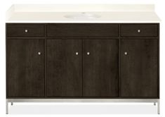 an image of a bathroom vanity with white counter top and dark wood cabinet door fronts