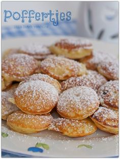 powdered sugar covered pastries on a plate