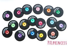 a group of black buttons with colorful circles on them