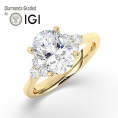 a diamond engagement ring with three pear shaped diamonds on the side and an igi logo above it