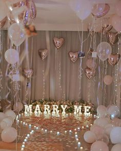 balloons and confetti decorate the entrance to a marquee