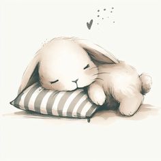 a white rabbit sleeping on top of a pillow