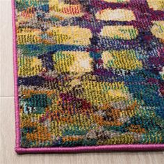 a multicolored area rug on the floor