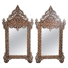 a pair of mirrors sitting next to each other