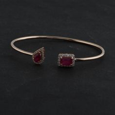 Ruby Bracelet, 18k/14Kt Gold Ruby Bangle, July Birthstone Bracelet, Halo Open Bangle, Open Cuff Bracelet,Ruby Bezel Bracelet,Flexible Bangle Details :- Item Code:- SEB-6021B Gross Weight :- 5.89 gm 18k White Gold Weight :- 5.42 gm Diamond Weight :- 0.36 ct. (Si Clarity Hi Color Certified Diamonds) Ruby Weight :-1.97 ct. Size : 5.62 X 8.06 mm ≫ FAQ below for more detail. ✦ Sizing We can adjust most items to fit your sizing preferences. Most items can be made to any size and length. Please leave a Luxury Gemstone Cuff Bracelet For Anniversary, Fine Jewelry Gemstone Cuff Bracelet For Formal Occasions, Formal Fine Jewelry Cuff Bracelet With Gemstone, Formal Gemstone Cuff Bracelet, Formal Gemstone Cuff Bracelet In Bangle Shape, Formal Gemstone Bangle Cuff Bracelet, Formal Yellow Gold Cuff Bracelet With Gemstone, Formal Fusion Bangle Bracelets, Fusion Style Formal Bangle Bracelets