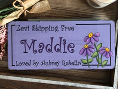 a wooden sign that says, zevi skipping free middle loved by lauren rabelo