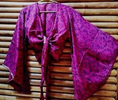 Handmade silk top, wide Japanese bell sleeves, one size fits all. India. 100% silk. Pink Silk Long Sleeve Kimono, Traditional Silk Tops For Summer, Purple Silk Long Sleeve Tops, Traditional Long Sleeve Blouse Piece For Summer, Long Sleeve Purple Silk Tops, Flowy Silk Long Sleeve Kimono, Pink Silk Long Sleeve Blouse Piece, Long Sleeve Pink Silk Blouse, Traditional Long Sleeve Purple Tops