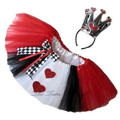 a red, white and black tutu skirt with a tiara on it's head