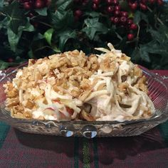 a glass bowl filled with food on top of a table