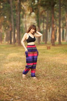 These cute hippie pants are colorful pants and handmade with rayon fabric which make them super comfy to wear. They have an elastic waist and elastic ankles. The two pockets are fitted with decorative strings. These trousers are are perfect for relaxing at home, working out, yoga running, beachwear and general casual wear. Also recommended for Thai massage, dance and festivals. Lannaclothesdesign products are uniquely designed and latest fashion trends. You can choose from many different colors Colorful Pants, Thai Fashion, Beach Clothing, Boho Clothes, Hippie Pants, Thai Massage, Women Yoga, Colored Pants, Clothes Women