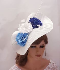 Large White Hat Fascinator with long Quill Feather and Blue and White Flowers, perfect for Royal Ascot, Kentucky Derby, Weddings Goodwood revival, Christening, Ascot or any special occasion. Can be customised with with different colour Flowers. please message. Gorgeous White straw weave Hat fascinator long quill feather and  Blue Silk flowers and Feathers This hat has been made by hand and very light to wear. This hat is designed to be worn tilted on the side of the head with  long Quill feathers and Feather detail for a beautifull Glamorous look. Attachment option: Alice band (BY DEFAULT HEADBAND WILL BE BLACK SATIN COVERED. IF YOU LIKE TO HAVE IN BROWN OR OTHER COLOURS PLEASE ADD A NOTE AT CHECKOUT) Blue Summer Wedding Costume Hats And Headpieces, Blue Costume Hats And Headpieces For Summer Wedding, White Church Hat With Handmade Flowers, White Summer Headpieces For Garden Party, Royal Blue Fascinator For Summer Weddings, White Fascinator With Handmade Flowers For Party, Adjustable White Fascinator For Garden Party, White Summer Fascinator With Handmade Flowers, Royal Blue Summer Wedding Fascinator