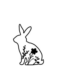 a black and white drawing of a rabbit with flowers