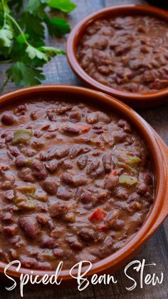 two brown bowls filled with chili and beans