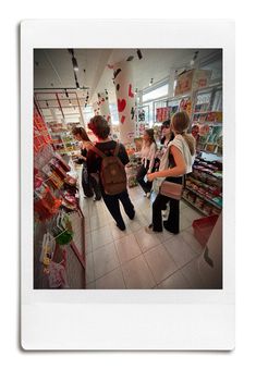 several people in a store looking at items