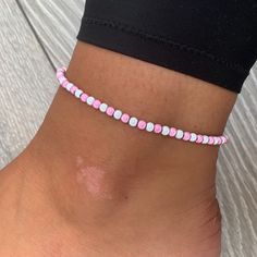 🌸 White and baby pink miracle bead anklet 🌸  ♥️Catches the light to give off a glow!  ♥️Perfect for nights out or even holidays!  ♥️Please message me if you have any questions each  ♥️ All anklets are made on rope. The two ends will need to be tied together and in a double knot so that the anklet does not come off. These are safe to wear in water.  Also available with matching bracelets, earrings and chokers! The colour may vary slightly due to most images being taken under direct sunlight or with flash to show you the full effect of the beads x  White beads may appear grey/silver when opened in a dark room. The full effect of the beads will shine through in different lights. Please note: Buyer pays for any return postage/ exchange postage x Cheap Pink Round Bead Anklets, Casual Pink Handmade Anklet, Adjustable Pink Anklet With Colorful Beads, Pink Beaded Anklets For Summer, Pink Beaded Summer Anklets, Pink Tiny Beads Anklets For Summer, Pink Anklets With Tiny Beads For Summer, Summer Pink Anklet With Colorful Beads, Handmade Pink Anklets As Gift