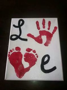 two handprints with the word love painted on them are shown in red and black