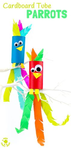 two colorful paper birds sitting on top of a branch with the words cardboard tube parrots