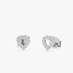 Penelope Add a touch of romance with these delicate Heart Outline Diamond Studs. Crafted from solid gold (available in yellow, white, or rose gold), they feature a classic heart design outlined with sparkling diamonds. Perfect for everyday wear or special occasions, these versatile earrings can be dressed up or down. They make a perfect gift for a loved one or a special treat for yourself. - Handmade- Solid Gold- Natural Diamonds - G Color, SI Quality Diamonds- Total Diamond Carat Weight: 0.20 c Elegant Diamond White Heart Earrings With Prong Setting, Elegant Diamond Heart Earrings With Brilliant Cut, Elegant Diamond Heart Earrings With Round Cut, Elegant Brilliant Cut Heart Earrings For Gifts, Elegant Diamond White Heart Earrings For Formal Occasions, Elegant Rose Gold Diamond Heart Earrings, Elegant Round Cut Heart Earrings For Formal Occasions, White Gold Heart Earrings With Prong Setting, Elegant Diamond White Heart Earrings