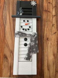 a snowman made out of an old piano