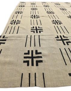 a large rug with black crosses on it