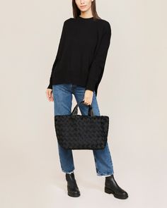 Handwoven neoprene and nylon handles in true black. The Tangier Medium Tote is an elegant top-handle bag. Tangier, Silhouette Crafts, Medium Tote, Staple Pieces, Handle Bag, Top Handle, Onyx, Top Handle Bag, Hand Weaving