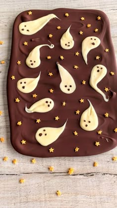 chocolate with white icing and sprinkles shaped like ghostes