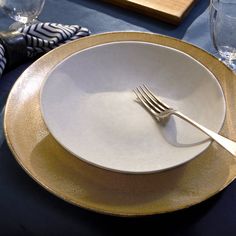 a white plate topped with a fork and knife