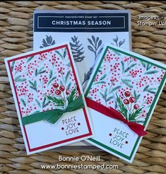 three christmas cards sitting on top of a wicker basket next to eachother