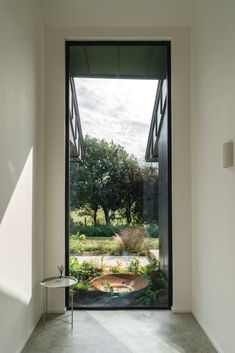 an open door leading into a garden