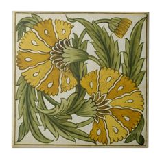 a tile with yellow and green flowers on it