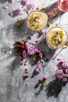 Firni in two bowls surrounded by flowers and petals. Firni Recipe, Phirni Recipe, Indian Rice Pudding, Creamy Rice Pudding, Pantry Recipes, Indian Rice, Milk And Sugar, Creamy Rice