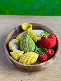 small crocheted fruits in a wooden bowl